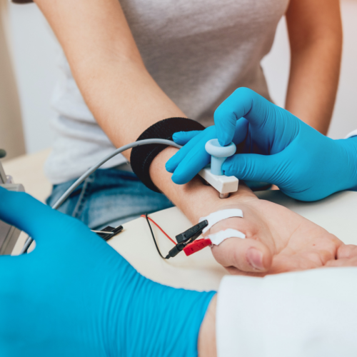 A woman is getting her blood pressure checked by a No-Fault doctor. A woman is getting her blood pressure checked by a No-Fault doctor.