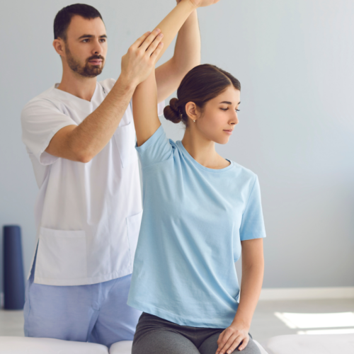 A woman is being assisted by a physical therapist specializing in workers compensation. A woman is being assisted by a physical therapist specializing in workers compensation.