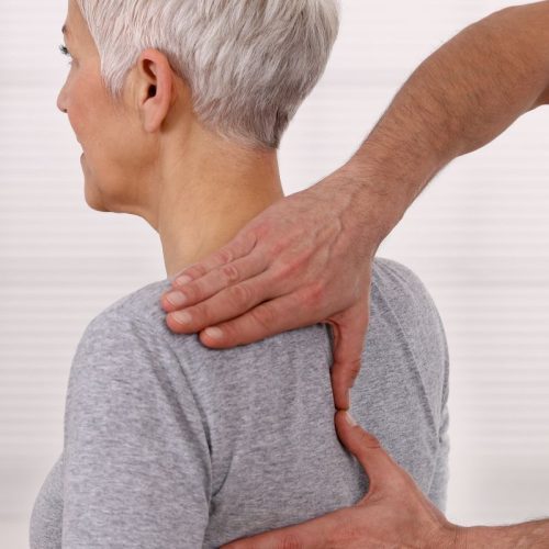 A woman is receiving a back massage from a no-fault doctor. A woman is receiving a back massage from a no-fault doctor.