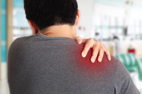 A man with a shoulder pain in a hospital seeking treatment from no-fault or workers compensation doctors. A man with a shoulder pain in a hospital seeking treatment from no-fault or workers compensation doctors.