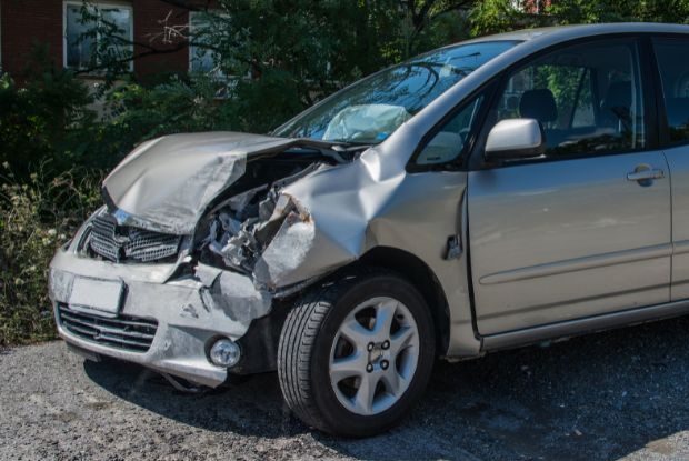 An image of a car that has been damaged in a car accident involving Workers Compensation.