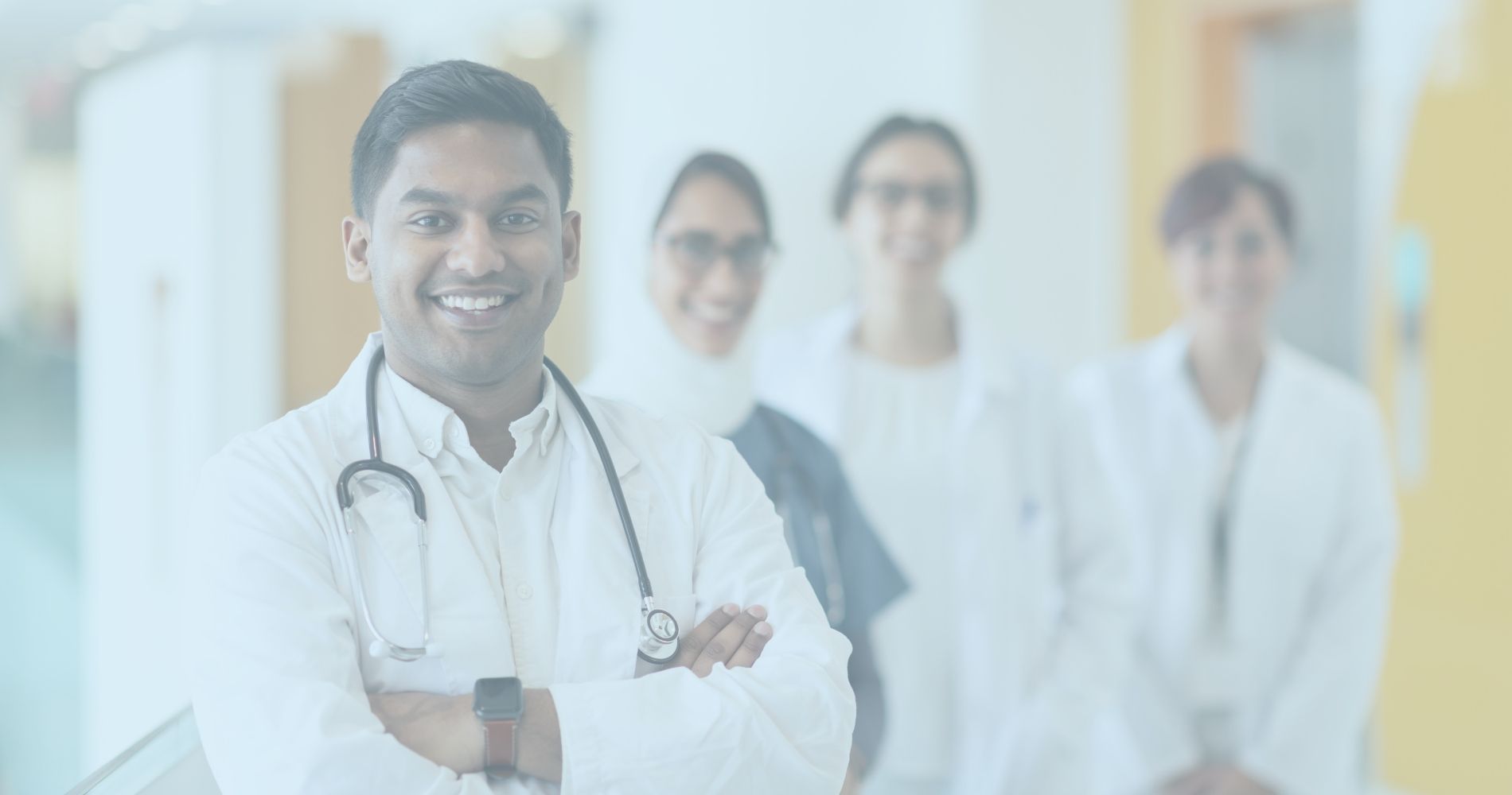 A group of workers compensation doctors standing in a hallway.