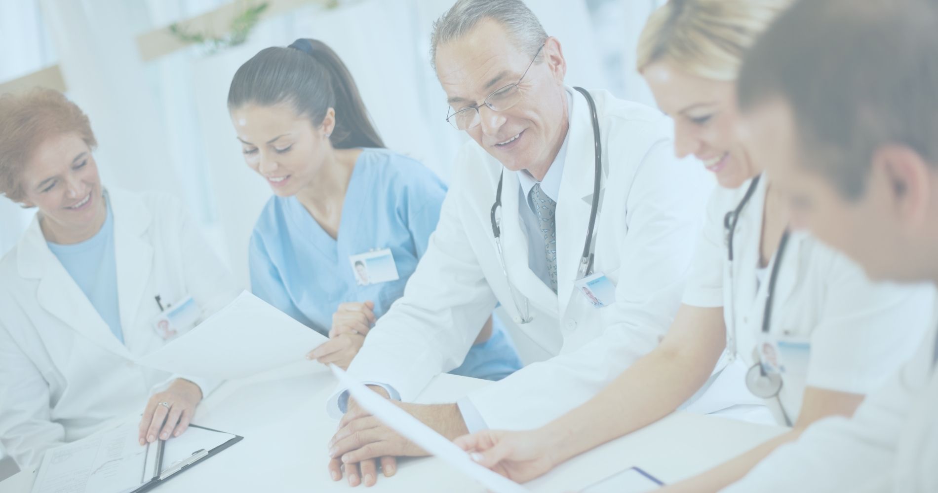 A group of No-Fault and Workers Compensation doctors sitting around a table.