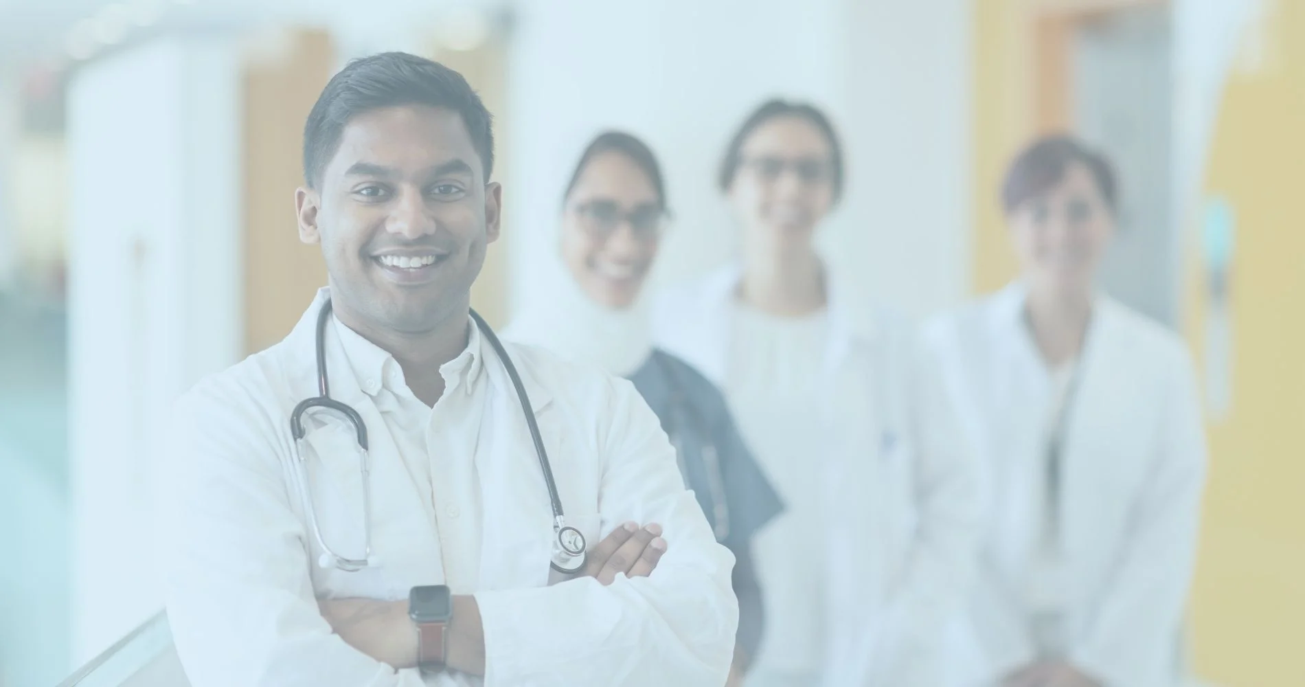 A group of workers compensation doctors standing in a hallway.